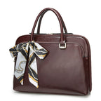 Sac ordinateur femme en cuir lisse, croco ou prince-de-galles