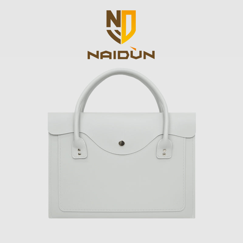 Pochette ordinateur femme à rabat ondulé en simili cuir et anses