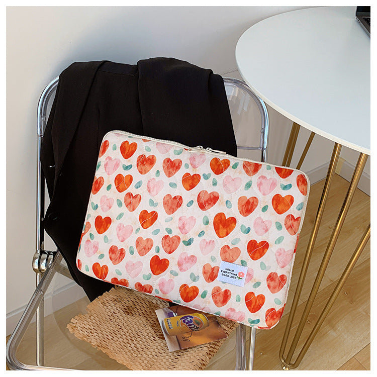 Pochette ordinateur femme matelassée, imprimé cœurs ou fleurs