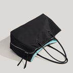 Sac ordinateur femme cabas noir, doublure turquoise contrastée