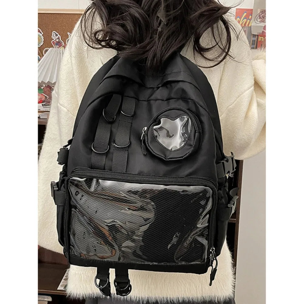 Sac à dos ordinateur femme à poche transparente et pochette cœur