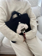 Pochette ordinateur femme noire à poignées et bourse en peluche