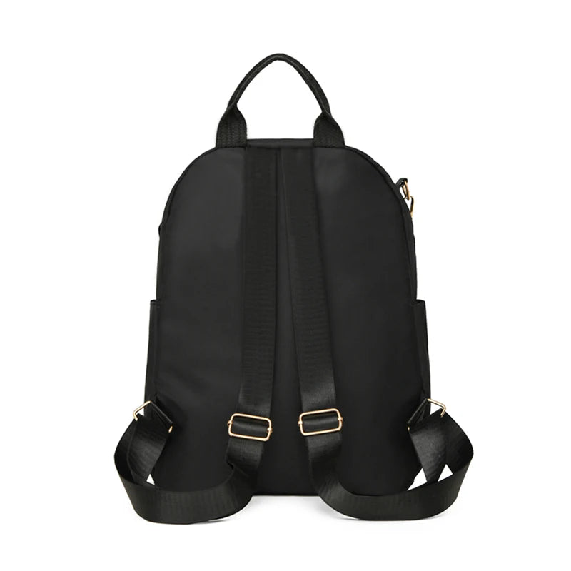 Sac à dos ordinateur compact en nylon matelassé, finitions dorées